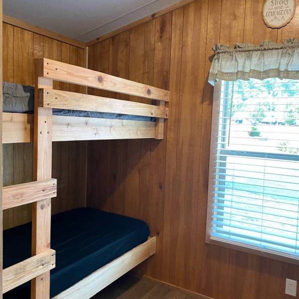 Yogi Bear cabin interior with bunk beds and window