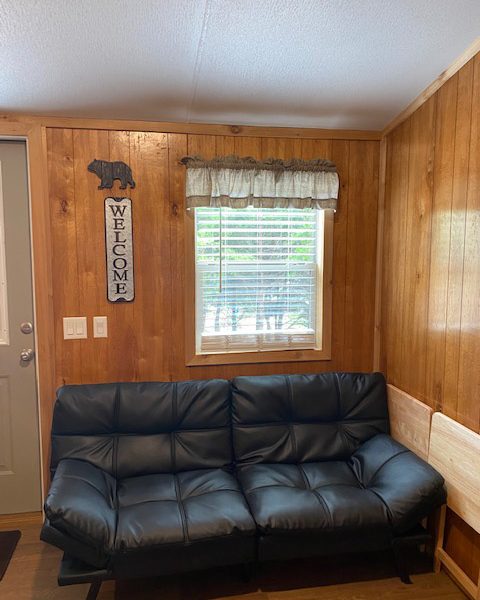 Ranger Smith cabin interior window and futon