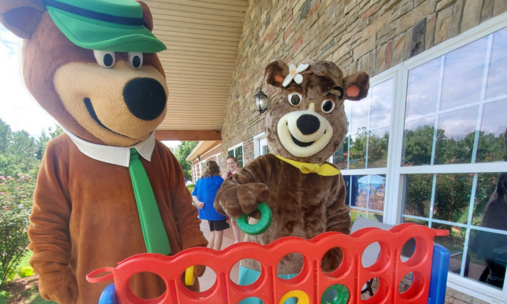 Yogi Bear Cindy Bear playing connect four at Jellystone Park Bremen